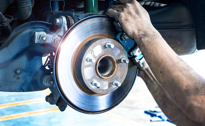 Close up car disk brake pad replacement service